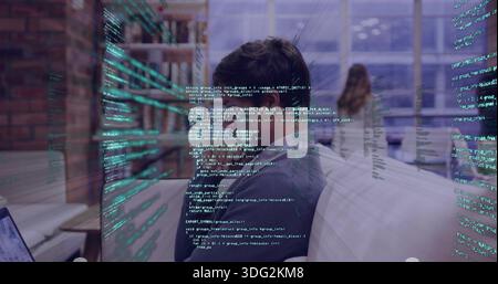 Leaning man wearing sweater focusing on monitor at office, with laptop and holographic code Stock Photo
