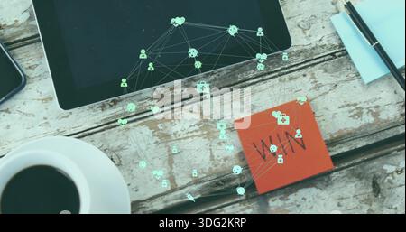 Displaying black tablet projecting green network icons on worn wooden tabletop, WHY sticky note Stock Photo