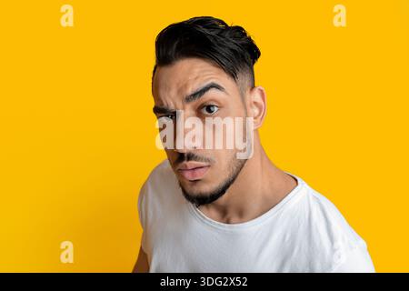 Top view of surprised arabic guy looking at camera Stock Photo