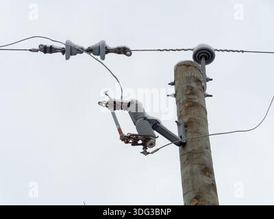 Dropout fuse cutout on a utility pole Stock Photo
