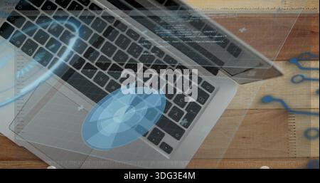 Aluminum laptop keyboard and trackpad showing holographic overlays on wood desk, notebook edge Stock Photo