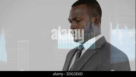 Businessman in suit and tie analyzing projected bar chart and line graph in office, copy space Stock Photo