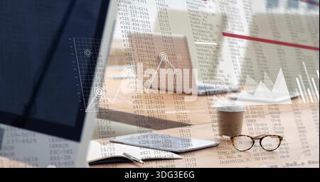 Displaying desk items sitting on wooden desk, showing tablet, laptops, cup, glasses, data overlay Stock Photo