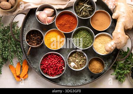 Many different spices. A collection of various spices and herbs on a light background. Top view. Stock Photo