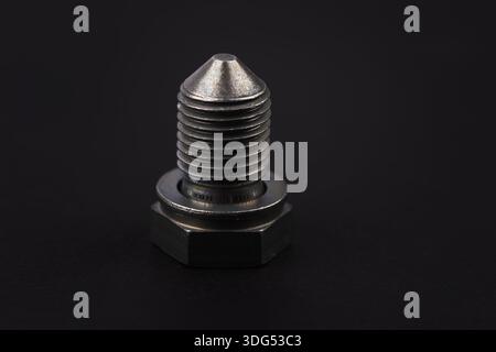 Metal bolt on dark background close up. Detail for design. Design elements. Macro. Stock Photo