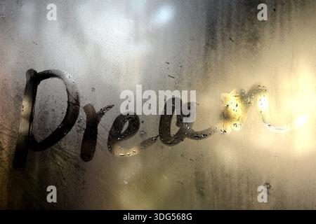 The word DREAM written on misted glass Stock Photo