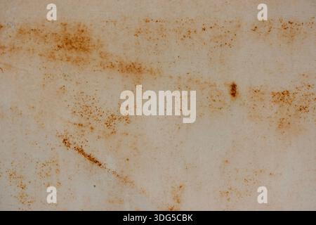 Abstract close-up of rusty metal surface showing corrosion and weathering textures Stock Photo