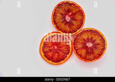 Red blood orange and orange slice, isolated on white background. Close up shot of Blood orange fruit isolated on white background. Fruit in white back Stock Photo