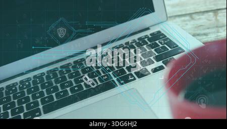 Showing laptop keyboard and trackpad running biometric scan on wood desk, fingerprint lock, red mug Stock Photo