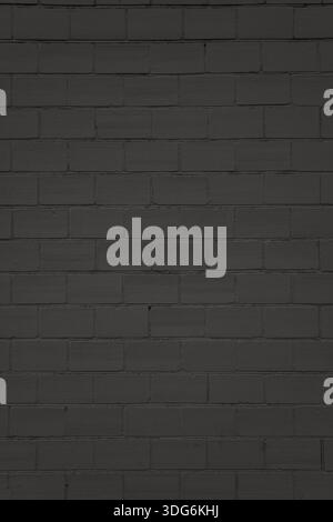 Black brick wall with uniform masonry and clean surface. Used as a structured background in visual projects. Stock Photo