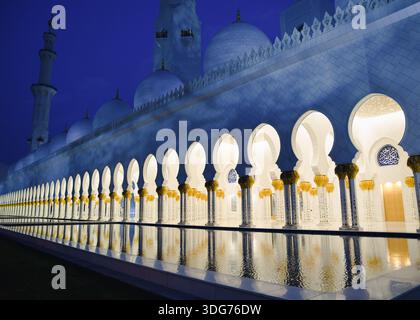 Illuminated Arches of Sheikh Zayed Grand Mosque at Night Stock Photo