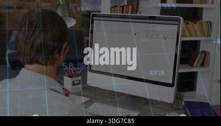 Working man wearing collared-shirt leaning at desk checking screen with data overlay, copy space Stock Photo