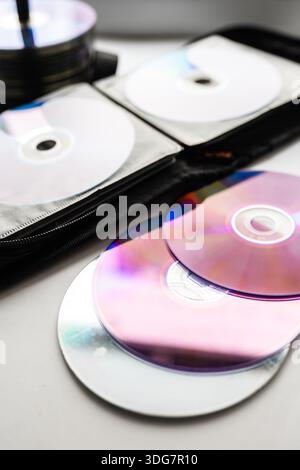 Bunch of CD and DVD discs organized in a disc holder. Stock Photo