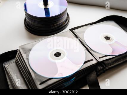 Bunch of CD and DVD discs organized in a disc holder. Stock Photo
