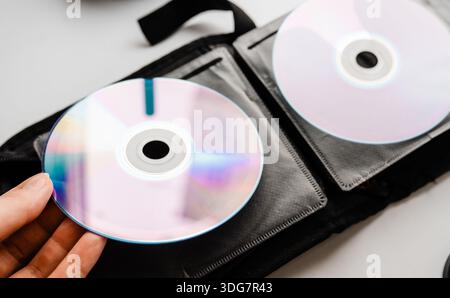 Bunch of CD and DVD discs organized in a disc holder. Stock Photo