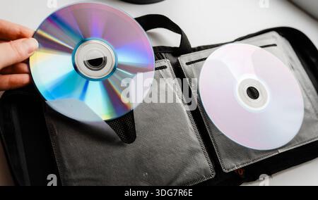 Bunch of CD and DVD discs organized in a disc holder. Stock Photo