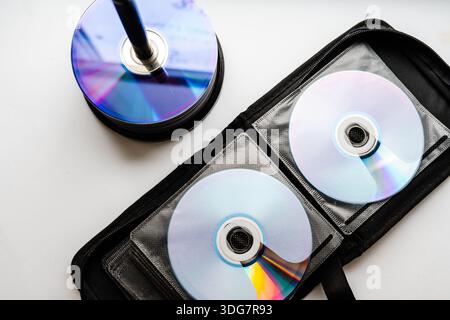 Bunch of CD and DVD discs organized in a disc holder. Stock Photo