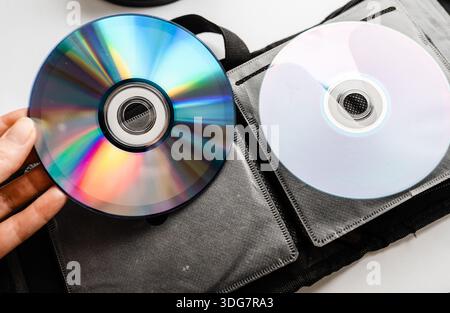 Bunch of CD and DVD discs organized in a disc holder. Stock Photo