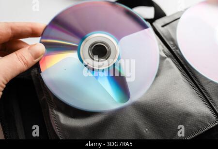 Bunch of CD and DVD discs organized in a disc holder. Stock Photo