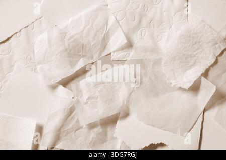 various beige color piece of paper with irregular, ripped, and torn edges background. The rough, jagged edges of the texture paper Stock Photo