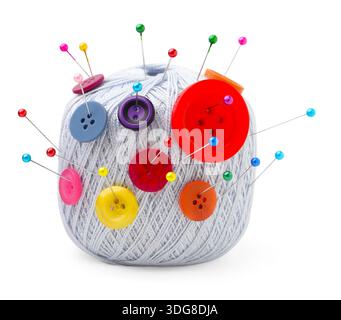 Ball of yarn with pins and buttons isolated on white Stock Photo