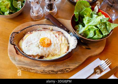 Swiss cheese crust with fried egg Stock Photo