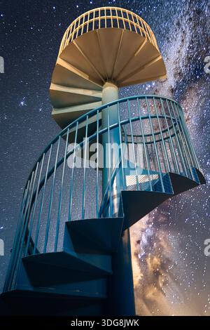 spiral staircase reaching up to the stars Stock Photo