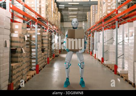 Robot holding cardboard boxes in warehouse. Futuristic technology in logistics Stock Photo