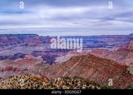 The sky is cloudy and the mountains are in the background. The mountains are brown and the sky is blue Stock Photo