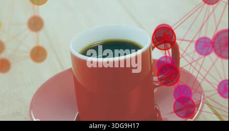 Displaying red ceramic cup filled with black coffee with saucer on wooden table, network overlay Stock Photo