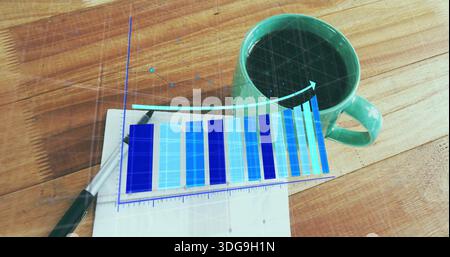 Displaying mint-green mug sitting on wooden desk, with notepad, pen, blue chart overlay, copy space Stock Photo