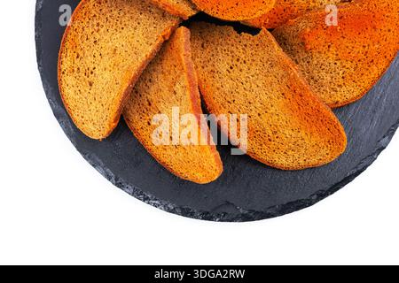 Rye bread crackers in spices on dark background, Beer snack, Stock Photo