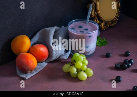 The art of food styling applied to fruit: a still life where strawberries are arranged in an ascending spiral, raspberries create a winding path, and Stock Photo