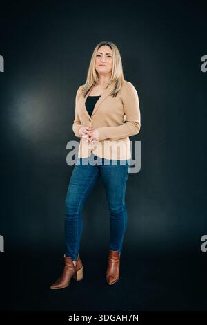 Confident businesswoman posing in business casual attire Stock Photo