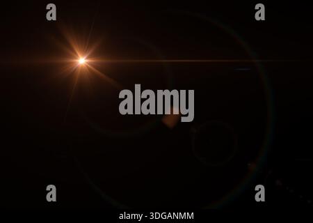 Sun flare on black. Solar lens flare effects. Abstract circle Digital lens Flare, light leaks. Abstract overlays background. Stock Photo