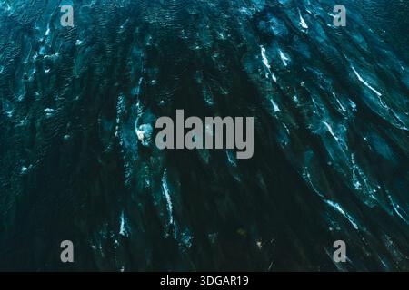 Dark Blue Water Surface with Dynamic Natural Ripple Patterns Stock Photo