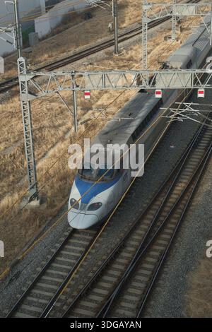 Seoul, South Korea: High speed KTX train traveling on railway tracks near Seoul Station, showing modern rail transport infrastructure Stock Photo