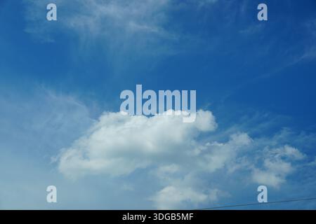 A large white cloud is in the blue sky Stock Photo