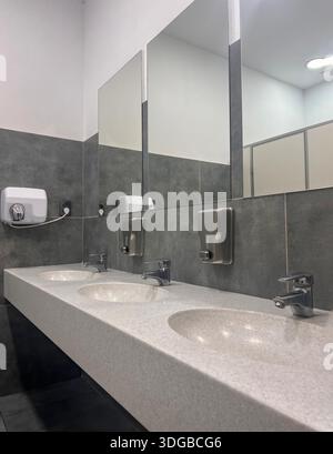 Modern restroom interior with stone gray tiles. interior of public ...