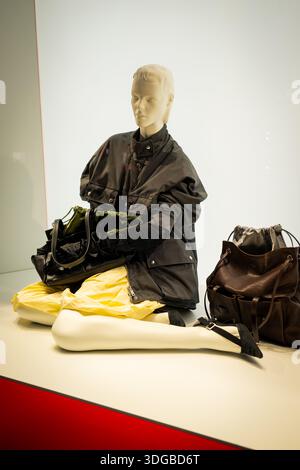 Milan, Italy - 2026, 13 Jan: Prada FW25 display featuring a chic mannequin with luxury handbags and stylish outerwear, highlighting modern elegance an Stock Photo