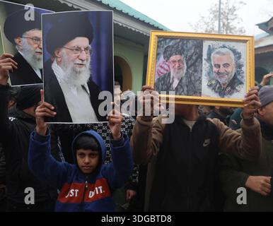 SRINAGAR, INDIA - JANUARY 16: Kashmiri Shiite Muslims shout slogans and ...