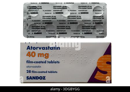 Packet of Atorvastatin film-coated tablets statins pack 40 mg with blister pack isolated on white background - Sandoz Stock Photo