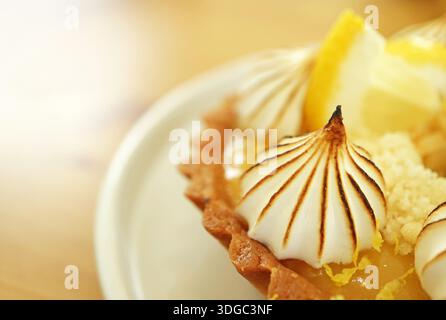 Swirl and Zest, Torch-Kissed Meringue on Silky Lemon Bliss Stock Photo