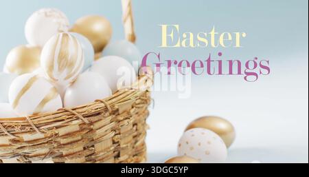 Image of easter greetings text over white and gold easter eggs in basket on blue background Stock Photo