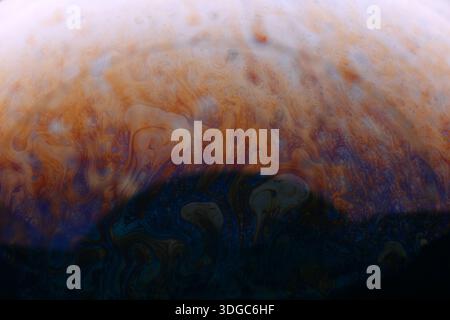 Vibrant abstract background featuring swirling orange and blue patterns, ideal for creative projects, presentations, and modern design concepts. Stock Photo