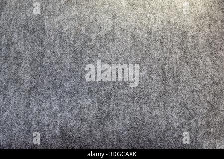 Soft gray wool felt fabric background showing a cozy, fuzzy melange of fibers and subtle texture, full frame, neutral backdrop ideal for textile, fash Stock Photo
