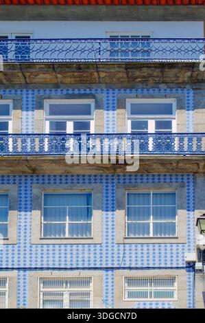 Amazing blue and white tiles'Blue iron wrought fences. Red roof Stock Photo