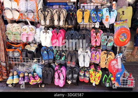 Beach footwear and flipflops on sale in shop in Koh Samet, Thailand Stock Photo
