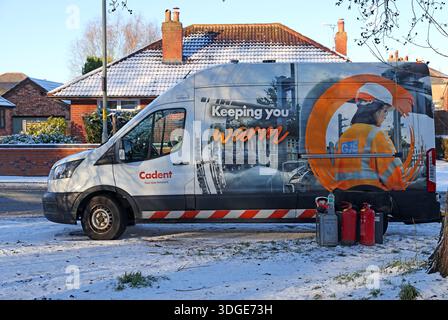 A Cadent Gas van and engineers working to restore domestic gas supply during winter conditions with snow on the ground on Chester Road in Grappenhall Stock Photo
