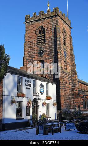 The Parr Arms public house and St Wilfrid’s Church on Church Lane in the village of Grappenhall near Warrington, Cheshire,photographed in winter Jan26 Stock Photo